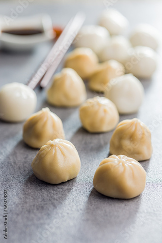 Xiaolongbao, traditional steamed dumplings. Xiao Long Bao buns on kitchen table.