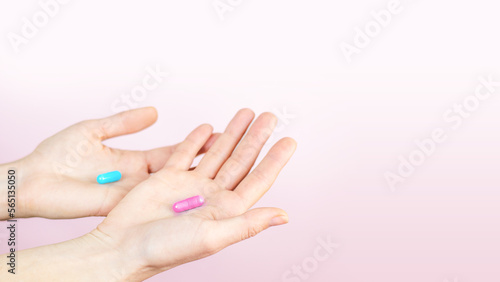 Blue and purple capsules lies in human hand isolated on white background Medical Treatment Pharmacy Health Space for text