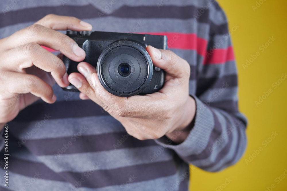 A men is taking pictures on a camera. A men is taking pictures on a camera.