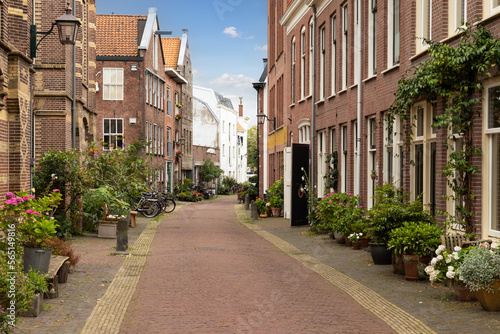Narrow street with flower boxes in the center of the Dutch city of Haarlem.
