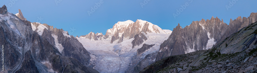 The panorama of Mont Blanc massif and Aiugulles towers in the morning dusk.