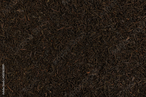 Dry tea leaf. Black tea background.