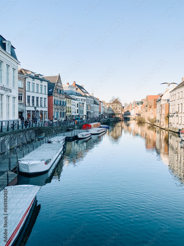 view of old city on a river in belgium