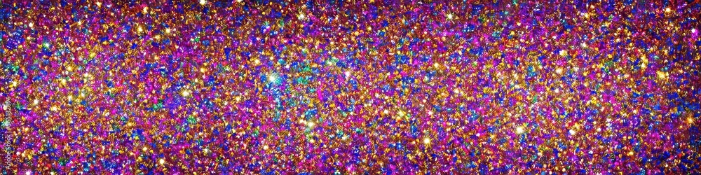 Panoramic image of polychromatic magical glitter. Full spectrum of a rainbow of colors