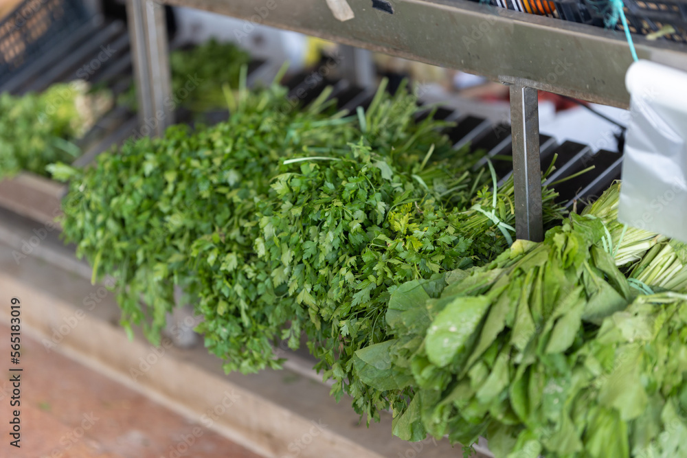 Fresh greens are sold on the market