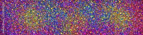 Panoramic image of polychromatic magical glitter. Full spectrum of a rainbow of colors
