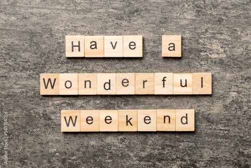 Fotografie Have a wonderful weekend word written on wood block