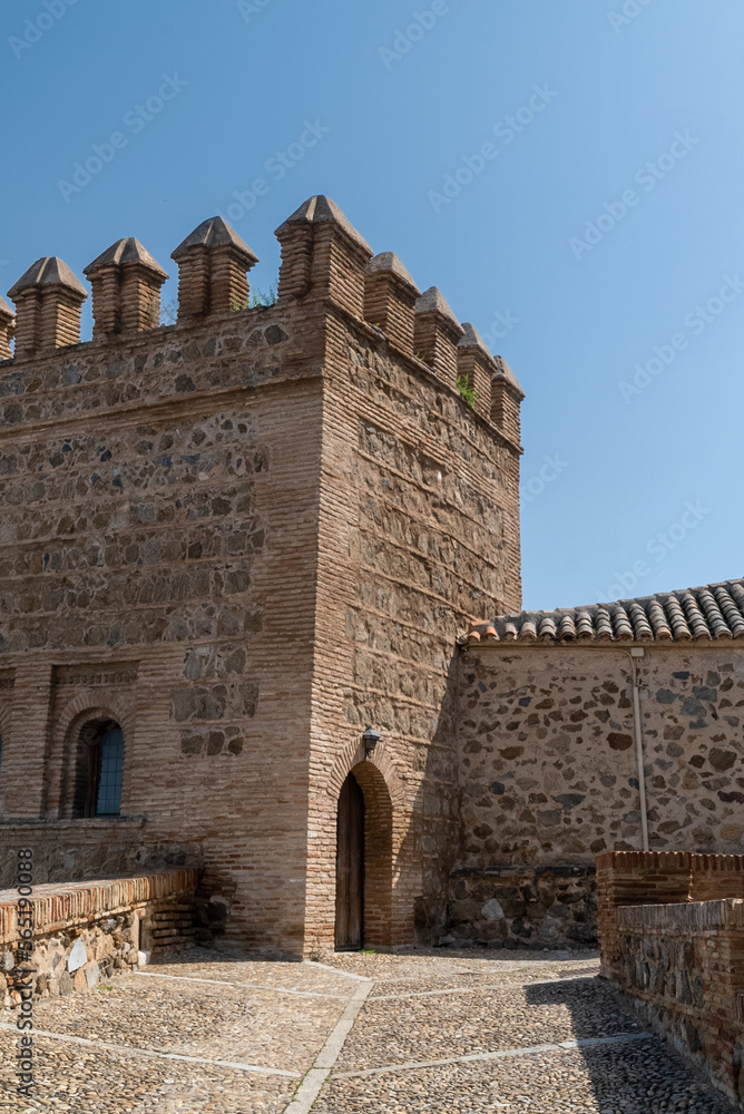 Toledo, Spain. April 5, 2022: Walls and fortresses of Toledo with beautiful blue sky.