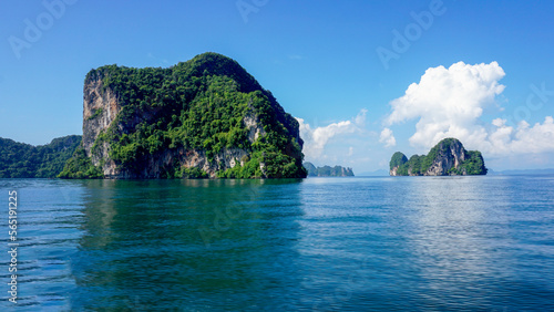 An island with a very beautiful scenery, surrounded by blue sea, sky background and beautiful white clouds. Soft and selective focus.