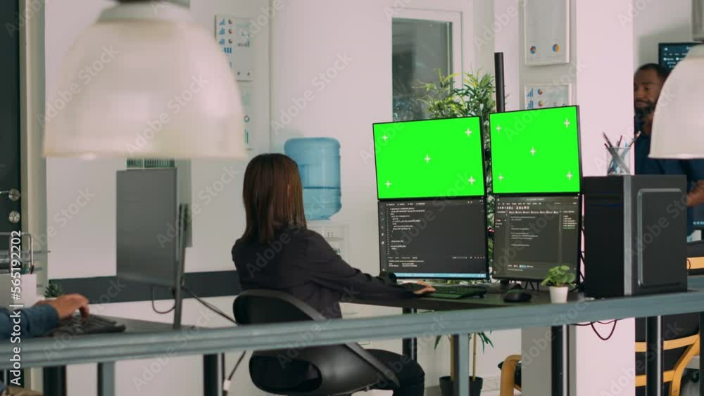 Asian system engineer using html script code and greenscreen on ...