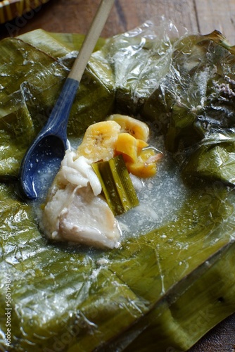 pis kopyor in banana leaves photo