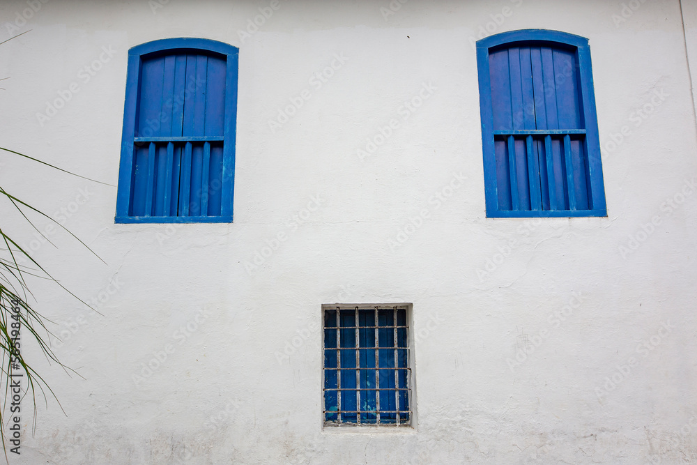 Facade with windows of old jail from the time of colonial Itanhaem, Coast of Sao Paulo state, Brazil