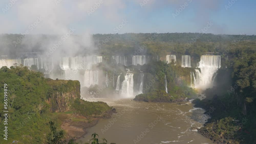 Wide shot of all the falls of Iguazu with water vapor escaping, in Brazil