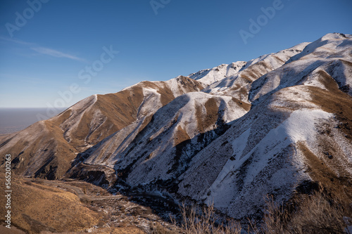 The mountains are lightly covered with snow. Winter landscape.