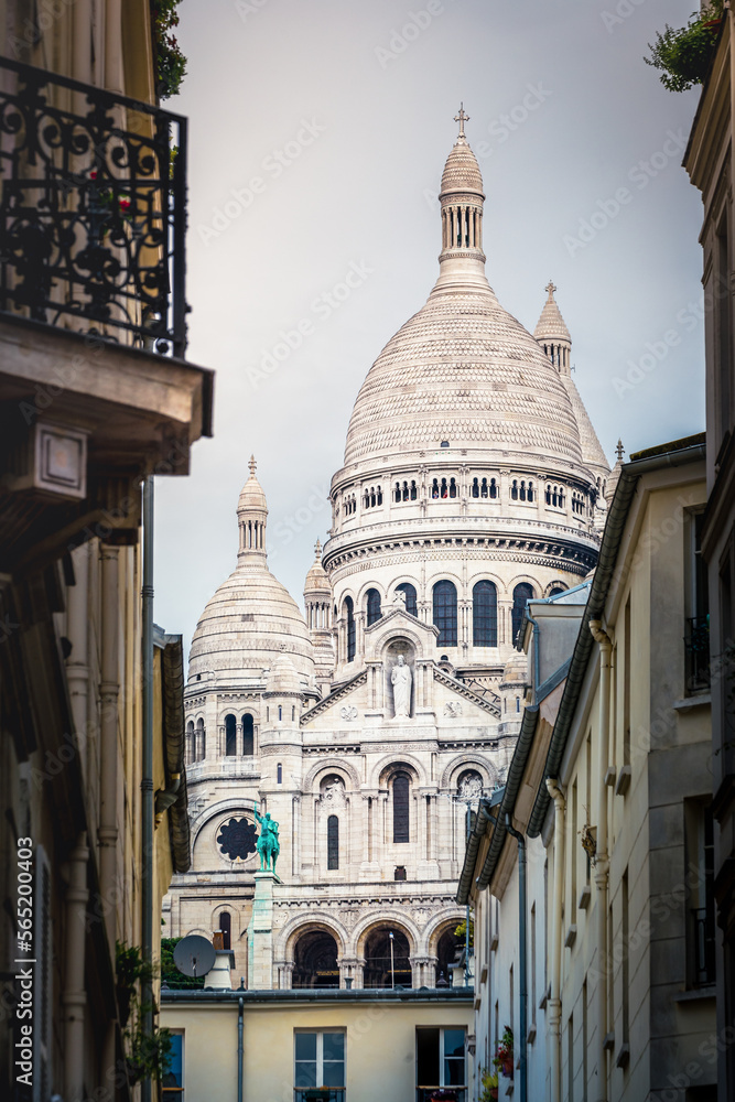 Sacre Coeur basilica behing montmartre parisien buildings, Paris, France