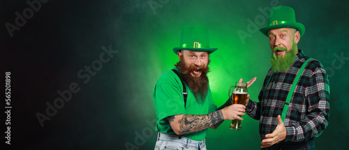 Bearded men with glasses of...