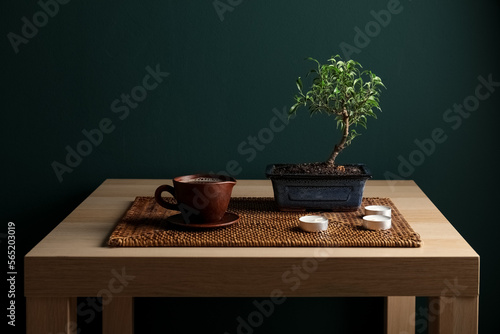 Table with Bonsai tree, cup...