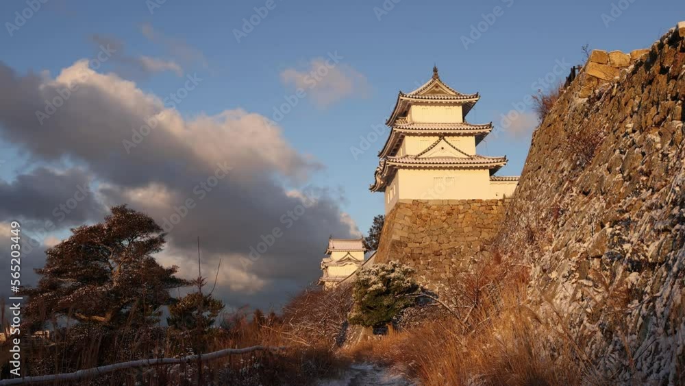 Historic Akashi Castle on ancient stone walls on snowy winter day Historic Akashi Castle on ancient stone walls on snowy winter day