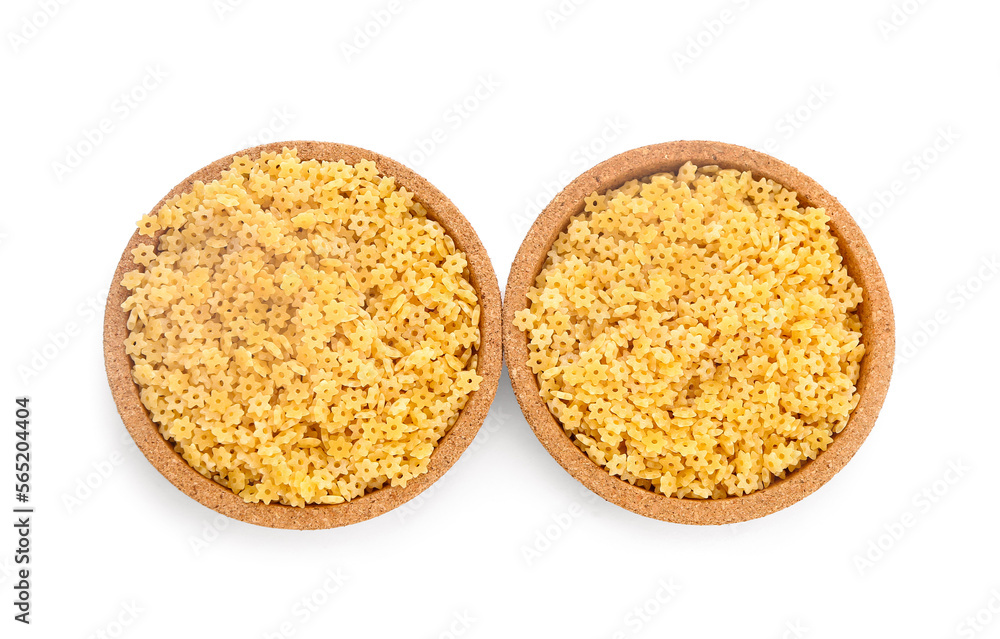 Plates of raw stelline pasta on white background Plates of raw stelline pasta on white background