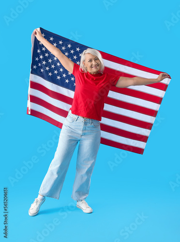 Mature woman with USA flag ...
