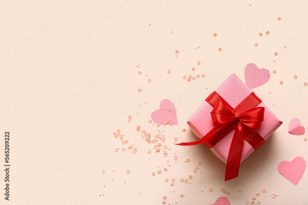 Composition with gift box, paper decor and sequins on color background. Valentine's Day celebration Composition with gift box, paper decor and sequins on color background. Valentine's Day celebration