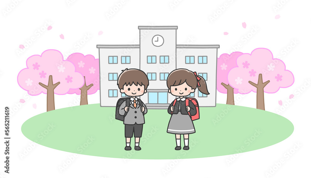 入学式　校舎の前に立つ新一年生の男の子と女の子