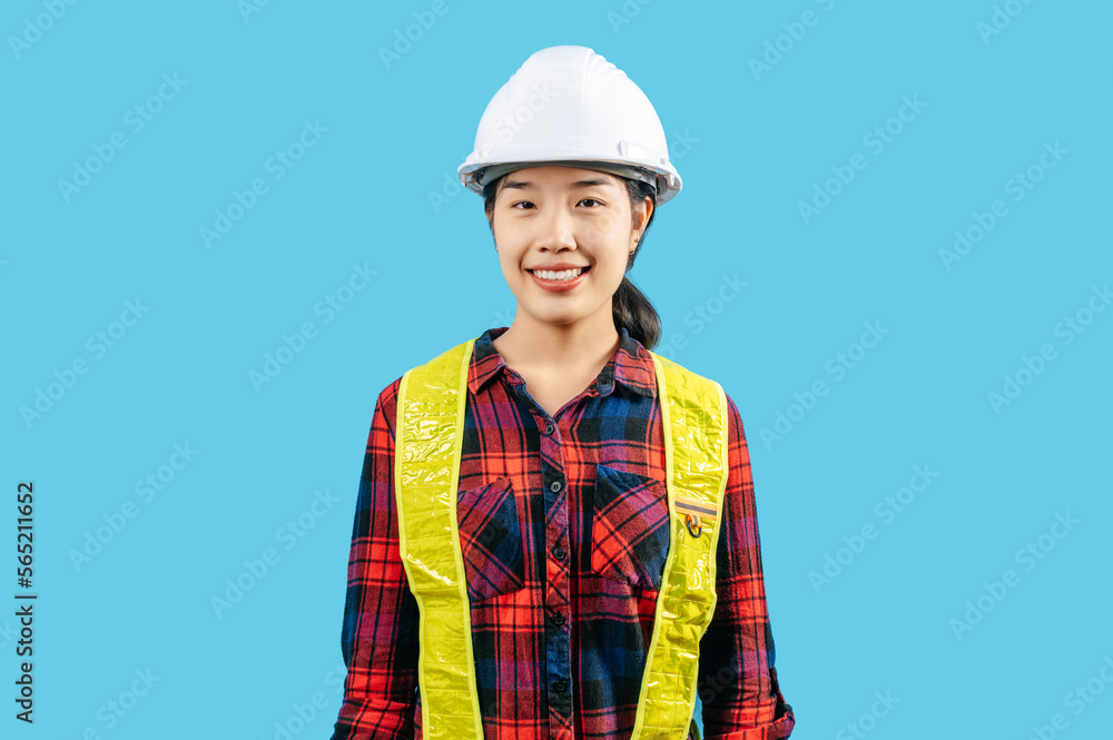 Young asian engineer female wearing safety jacket and helmet