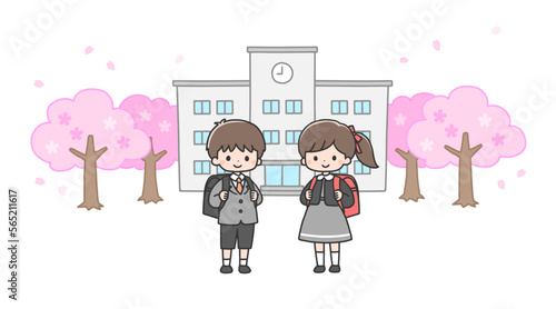 入学式　校舎の前に立つ新一年生の男の子と女の子