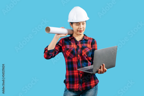 Young asian engineer female with blue print and laptop computer posture
