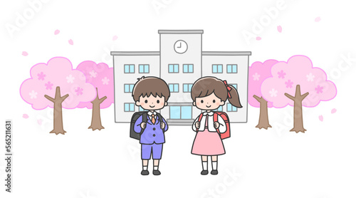 入学式　校舎の前に立つ新一年生の男の子と女の子