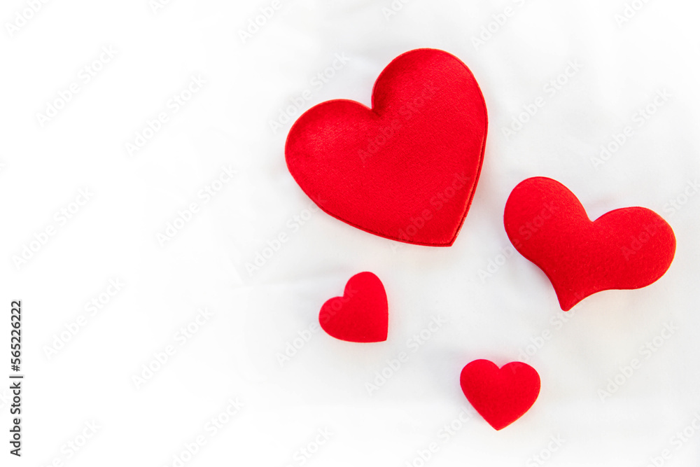 Heart shape with Gift box packed for honeymoon lover on white bed honeymoon suit.Valentine's day concept. Beautiful blurry background.heart lay on the bed.