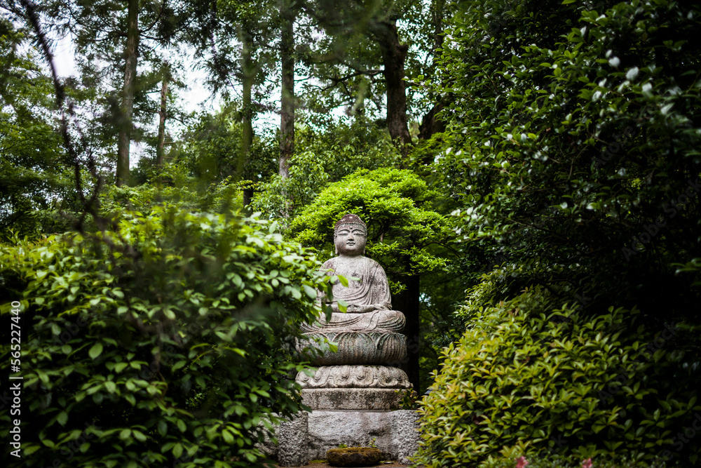 A small buddha statue at the Ryoan-ji Temple in Kyoto, Japan. A small buddha statue at the Ryoan-ji Temple in Kyoto, Japan.