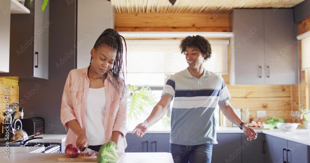 Happy african american couple dancing together in log cabin, slow motion Happy african american couple dancing together in log cabin, slow motion
