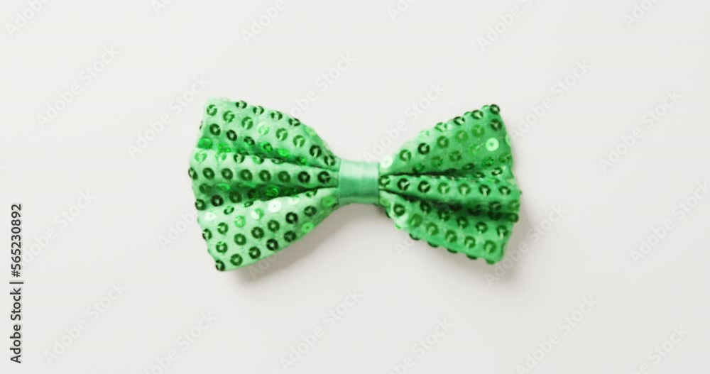 Video of st patrick's green bow tie with copy space on white background
