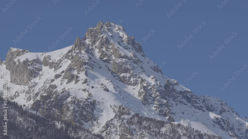 Tight shot of a high mountain peak in the mountains of western Wyoming. Shot in 4K Tight shot of a high mountain peak in the mountains of western Wyoming. Shot in 4K