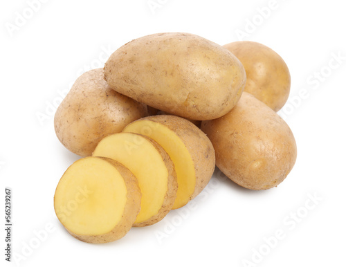 Whole and cut fresh potatoes on white background