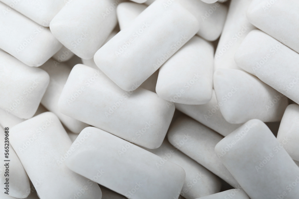 Tasty white chewing gums as background, top view Tasty white chewing gums as background, top view