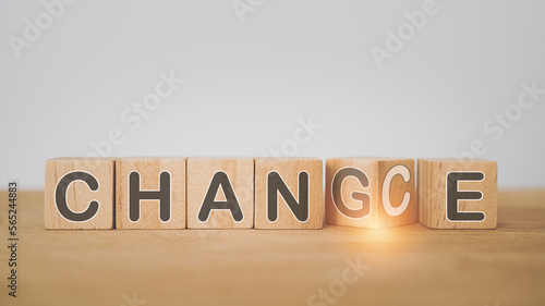 For business strategy and opportunities, vision, brainstorming , Personal development and career growth or change yourself concept. CHANGE AND CHANCE text on wooden cube block with flipped G to C photo