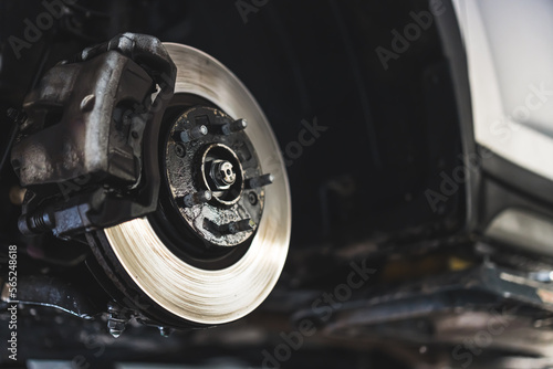 Closeup disc brake of vehicle for repair - Tire replacement car brake repairing. High quality photo photo