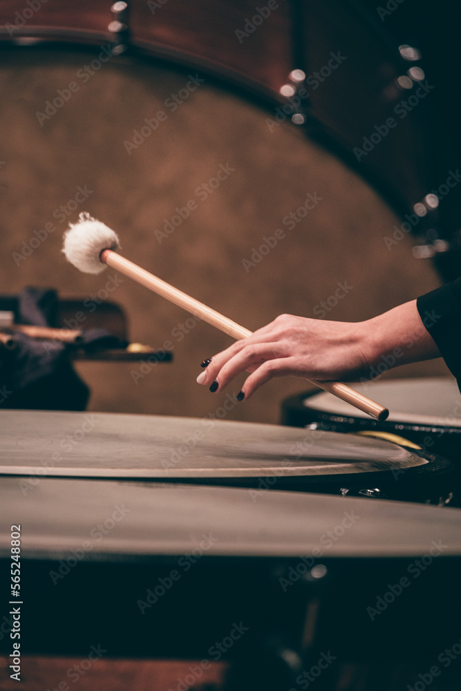 Indoor concert background abstract people performing music instruments Timpani in symphony orchestra