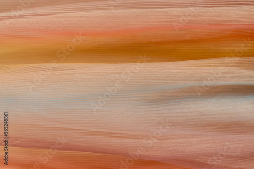 Pale ocher cotton vertical veil of orange fabric canvas background