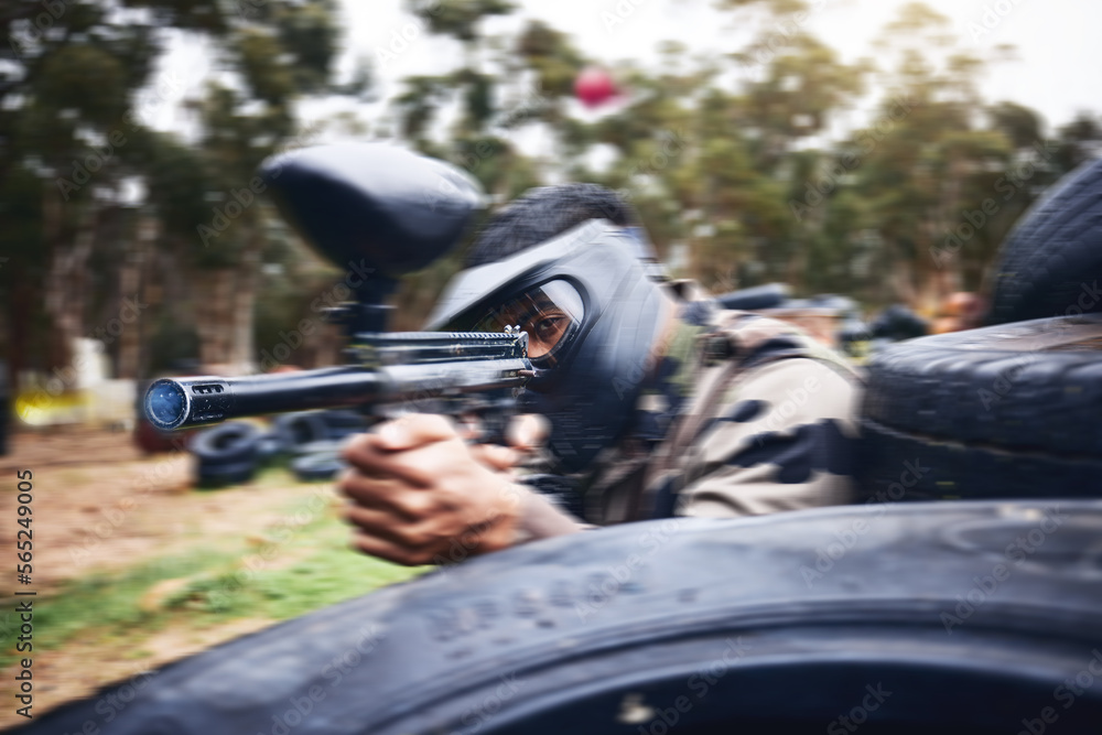 Paintball, gun or man playing a shooting game with fast action on a fun battlefield on holiday. Military mission, fitness or player aiming with weapons gear for war survival in an outdoor competition Paintball, gun or man playing a shooting game with fast action on a fun battlefield on holiday. Military mission, fitness or player aiming with weapons gear for war survival in an outdoor competition