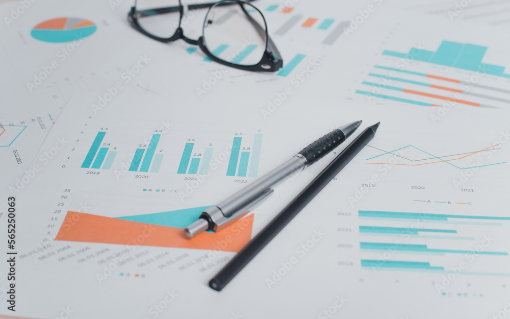 Close-up of business documents, pen, pencil, glasses at workplace. Accounting and financial concept. Low angle view, selective focus Close-up of business documents, pen, pencil, glasses at workplace. Accounting and financial concept. Low angle view, selective focus