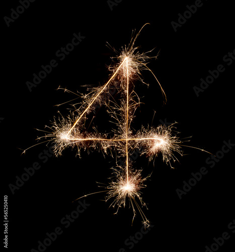 Sparkling burning creative number 4 isolated on black background. Beautiful glowing golden overlay object for design holiday greeting card. Creative lettering number 4 written with burning sparklers