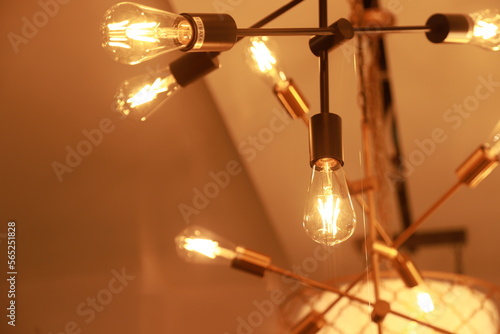 industrial model chandelier with light bulb hanging from a ceiling