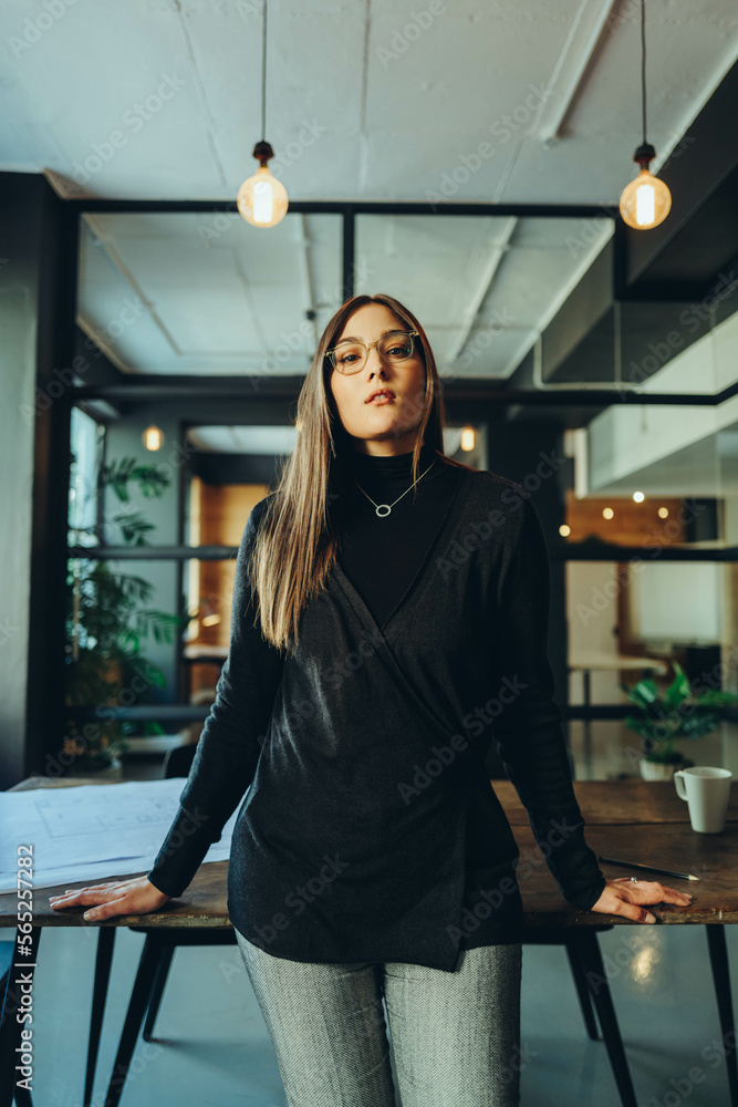 Female business professional standing in a boardroom