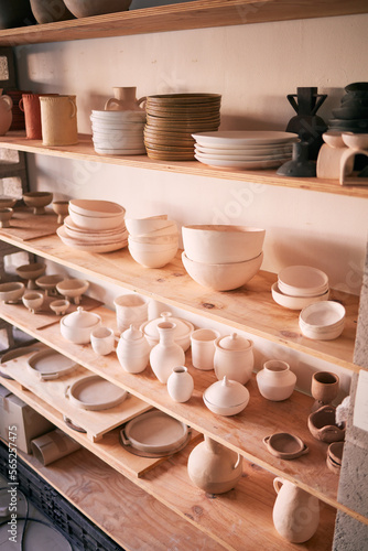 Pottery background, ceramics store and shelf in creative studio of manufacturing startup. Clay design, collection and display in workshop, small business and retail craft market of stock production