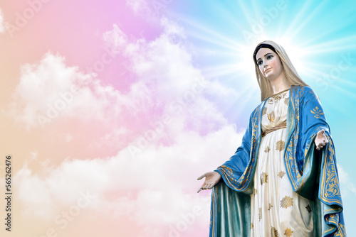 Statue of Our lady of grace virgin Mary with beautiful Sky Pastel with abstract colored background and wallpaper in sweet color. at Thailand.