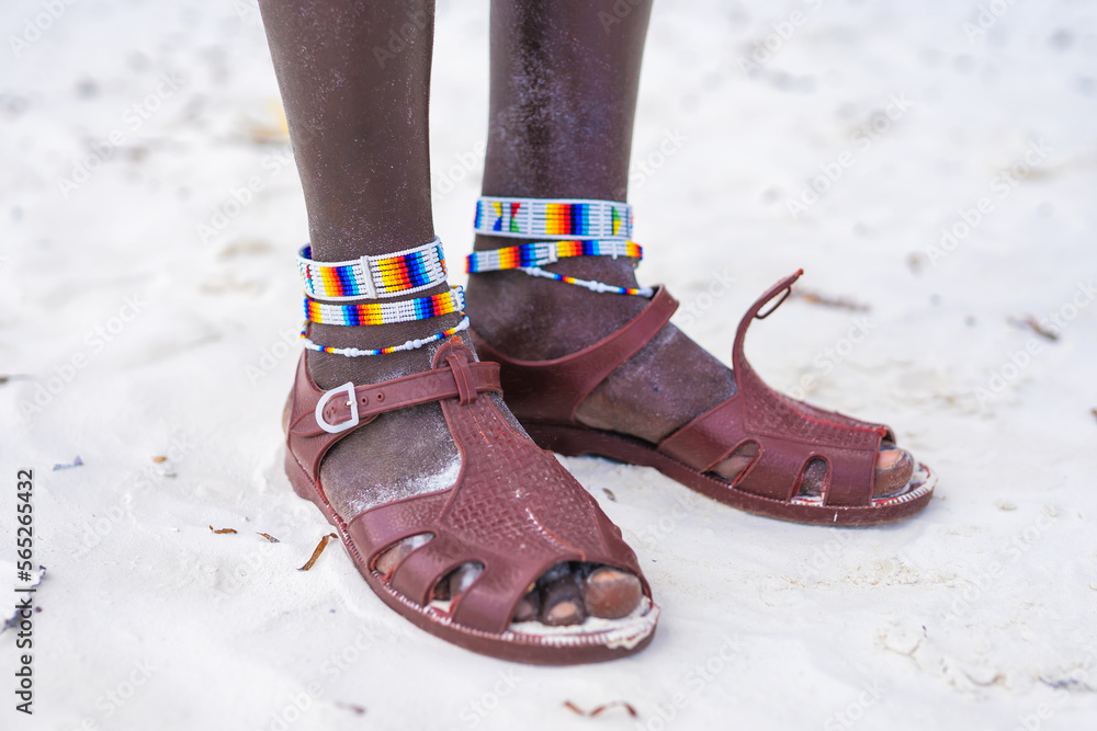 Travelling Kenya, Masai clothing and accessories details from Diani Beach Kendwa beach Zanzibar Kendwa Tanzania. Flip flops sandals of the Masai close up