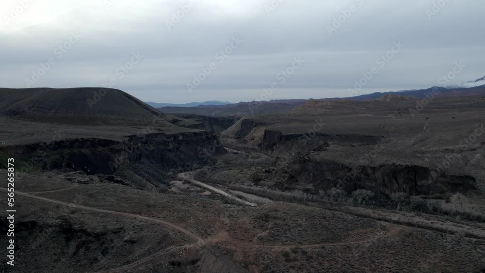 The Virgin River flowing through a rugged gorge in Southern Utah - aerial flyover The Virgin River flowing through a rugged gorge in Southern Utah - aerial flyover